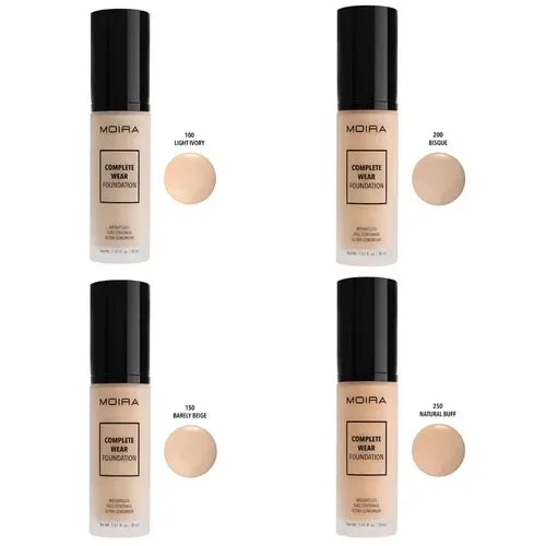 Four shades of MOIRA Complete Wear Foundation in pump bottles with sample swatches labeled Light Ivory, Bisque, Barely Beige, and Natural Buff.