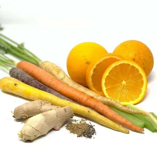 Brightening Exfoliating Mask with fresh carrots, oranges, ginger, and natural ingredients for radiant skin.