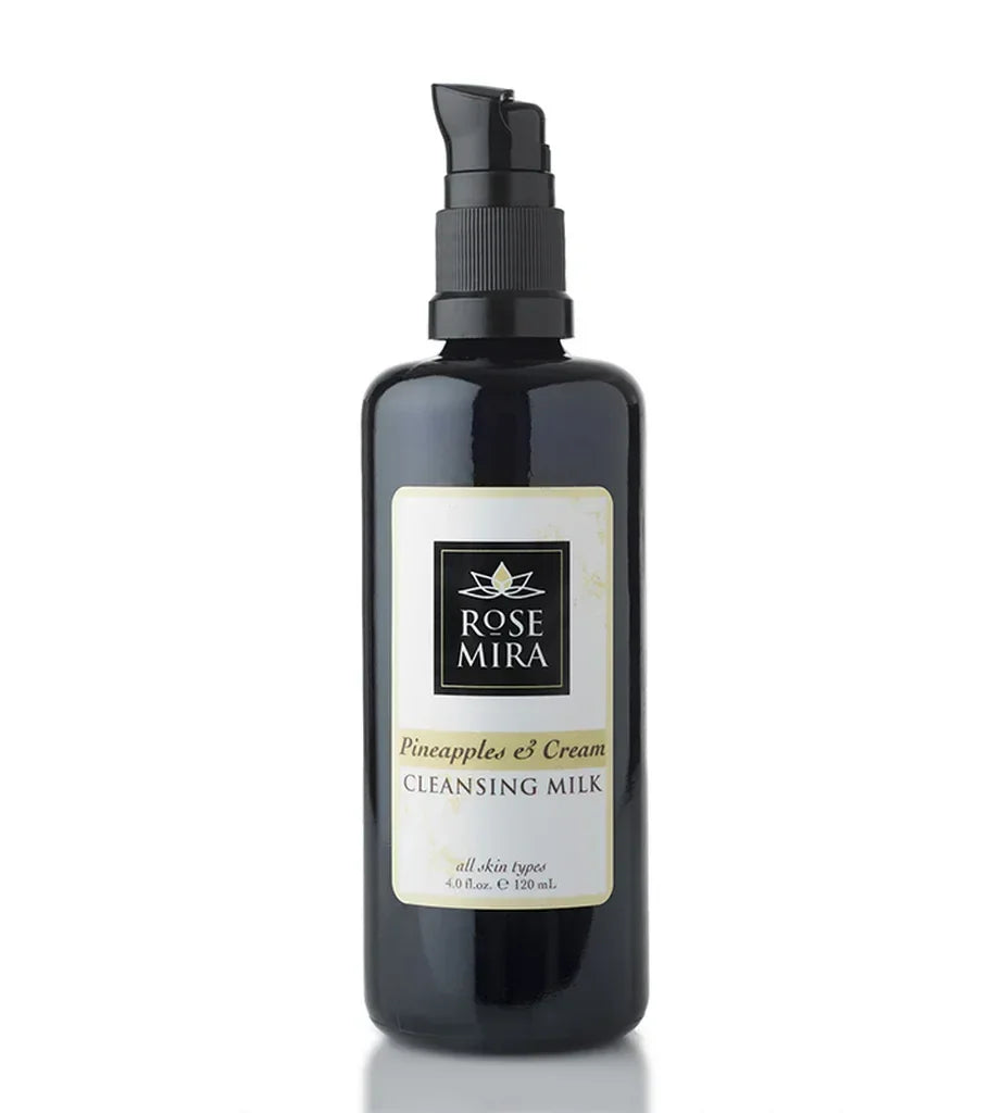 Bottle of Pineapples & Cream Cleansing Milk (all skin types + Sensitive) with black pump dispenser and label on white background